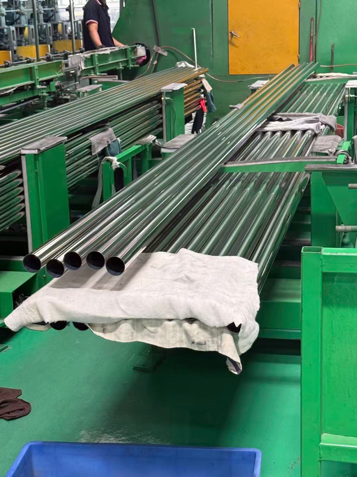 Polished stainless steel tubes on the production line